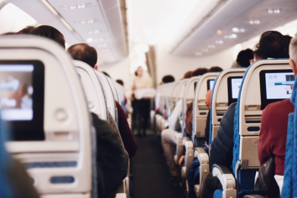 Aisle of a long-haul aircraft cabin during a flight