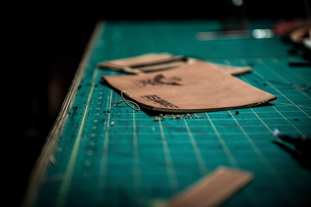 Artisan crafting leather goods by hand