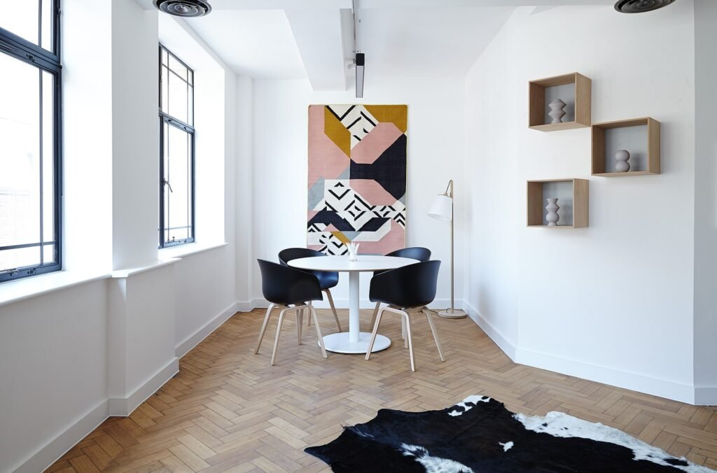 Bright minimal interior with white walls, wooden floor and floating shelves