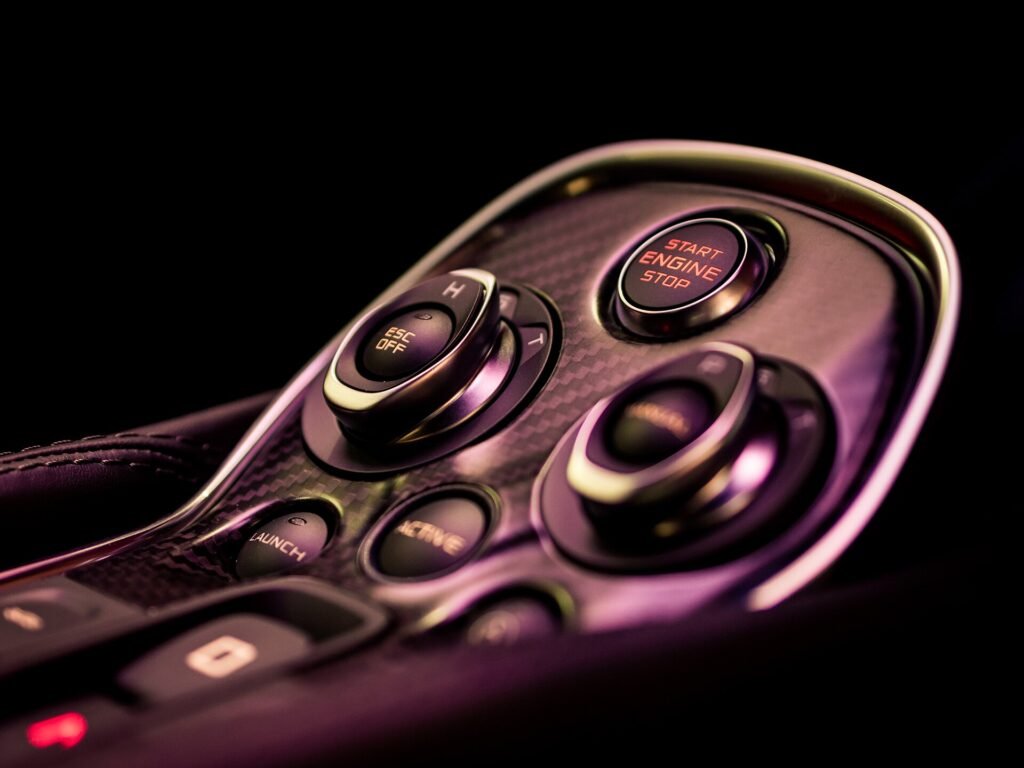Close-up of illuminated controls on a premium car centre console