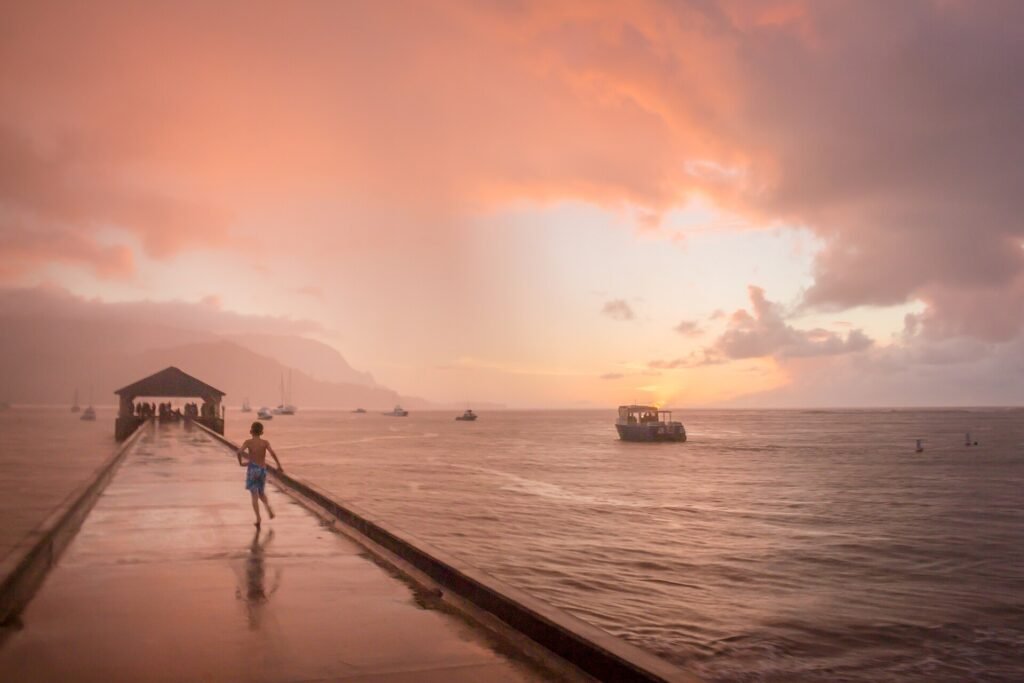 Hanalei Bay on Kauai's North Shore with green mountains behind the beach